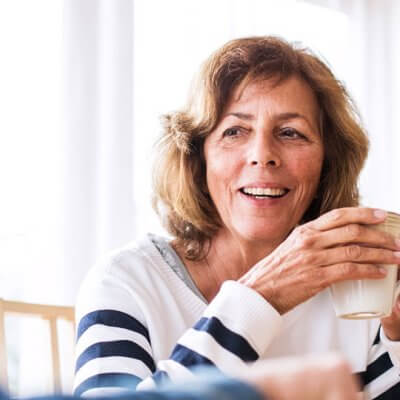 A couple talking and having tea.