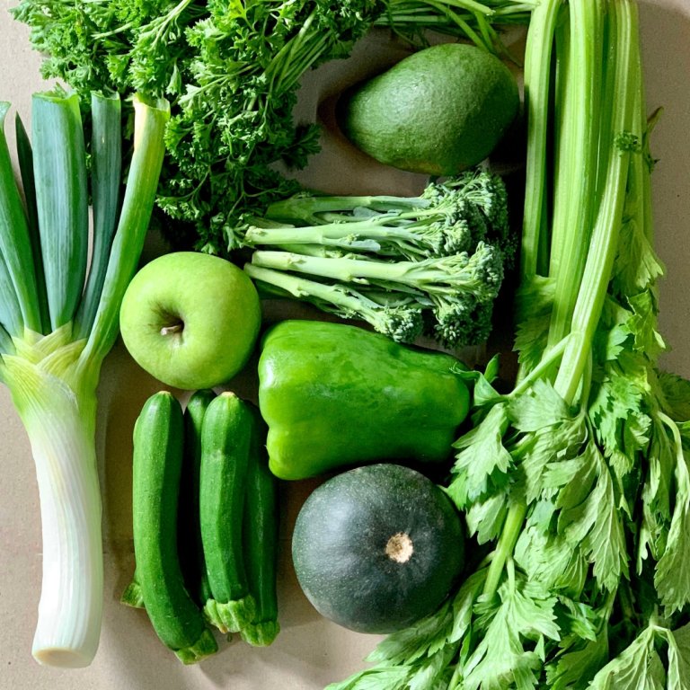 Green vegetables and a green apple.