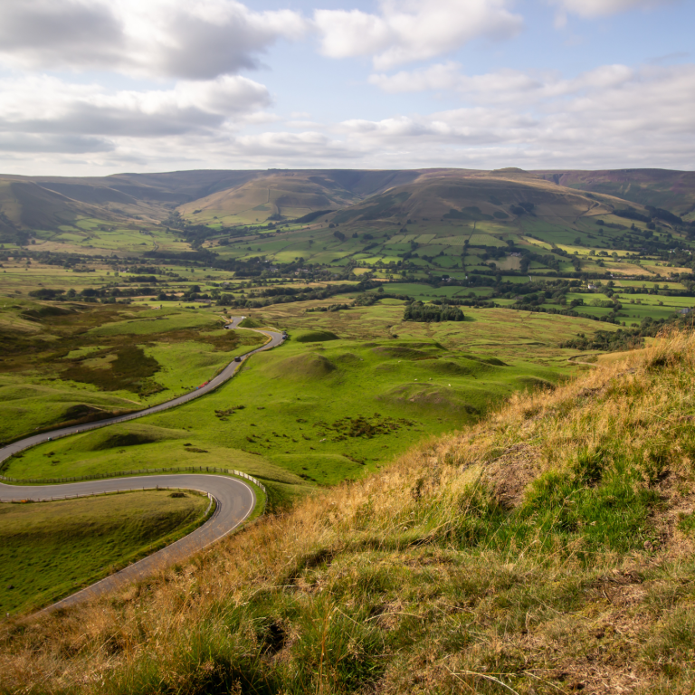 Stunning views from the high hills of Macclesfield Forest in the Peak District, showcasing rolling landscapes and lush greenery.